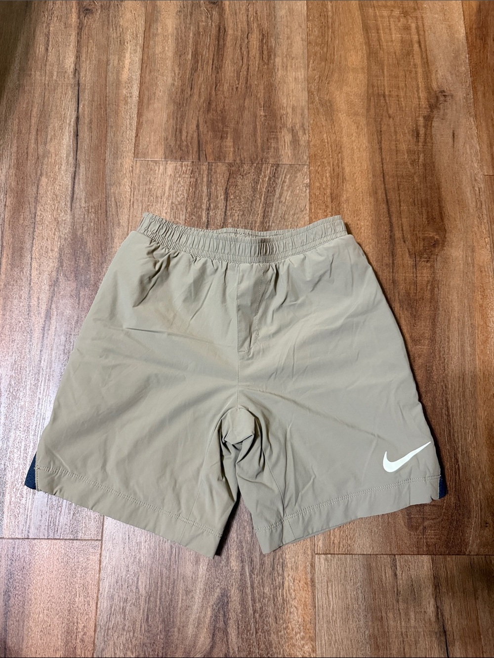 Nike Kids Tan Athletic Shorts with White Swoosh